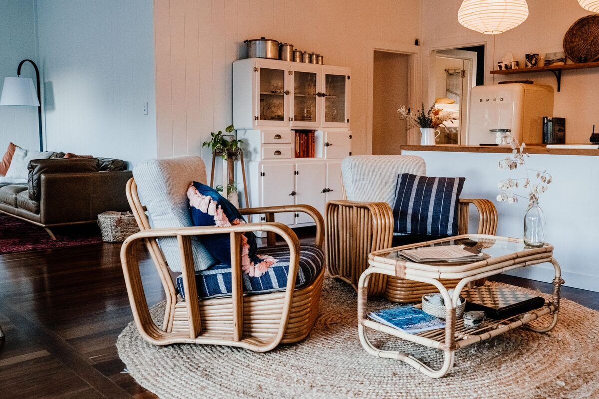 A bright rattan-furnished living space filled with natural daylight